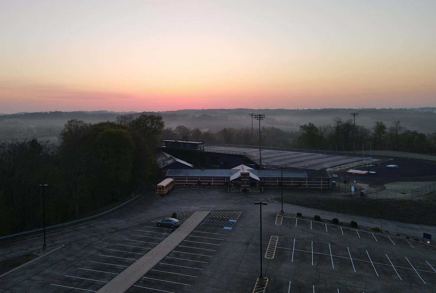 Foggy Sunrise Over Stadium